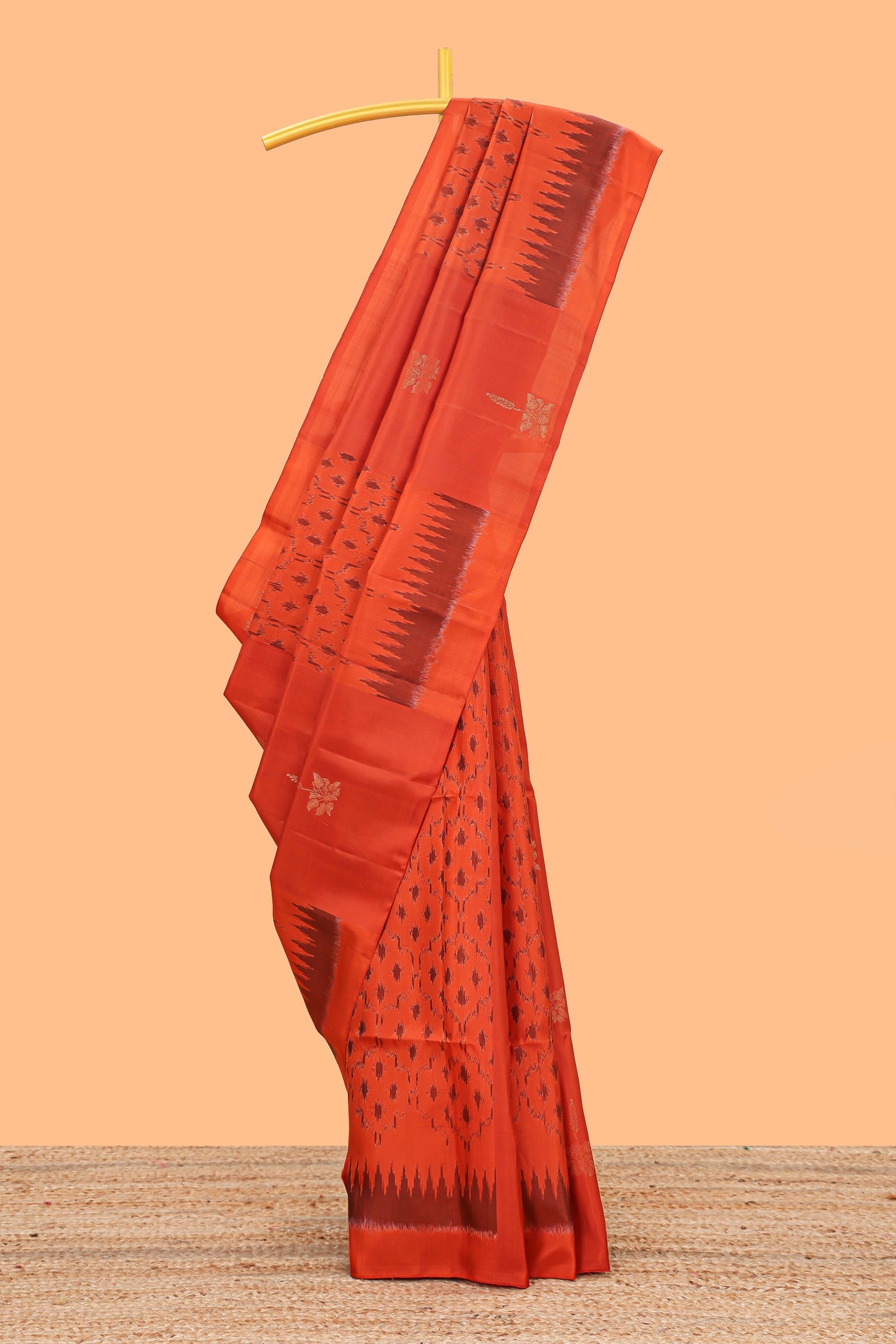 Orange ikkat style parambariya pattu saree with self border and contrast pallu