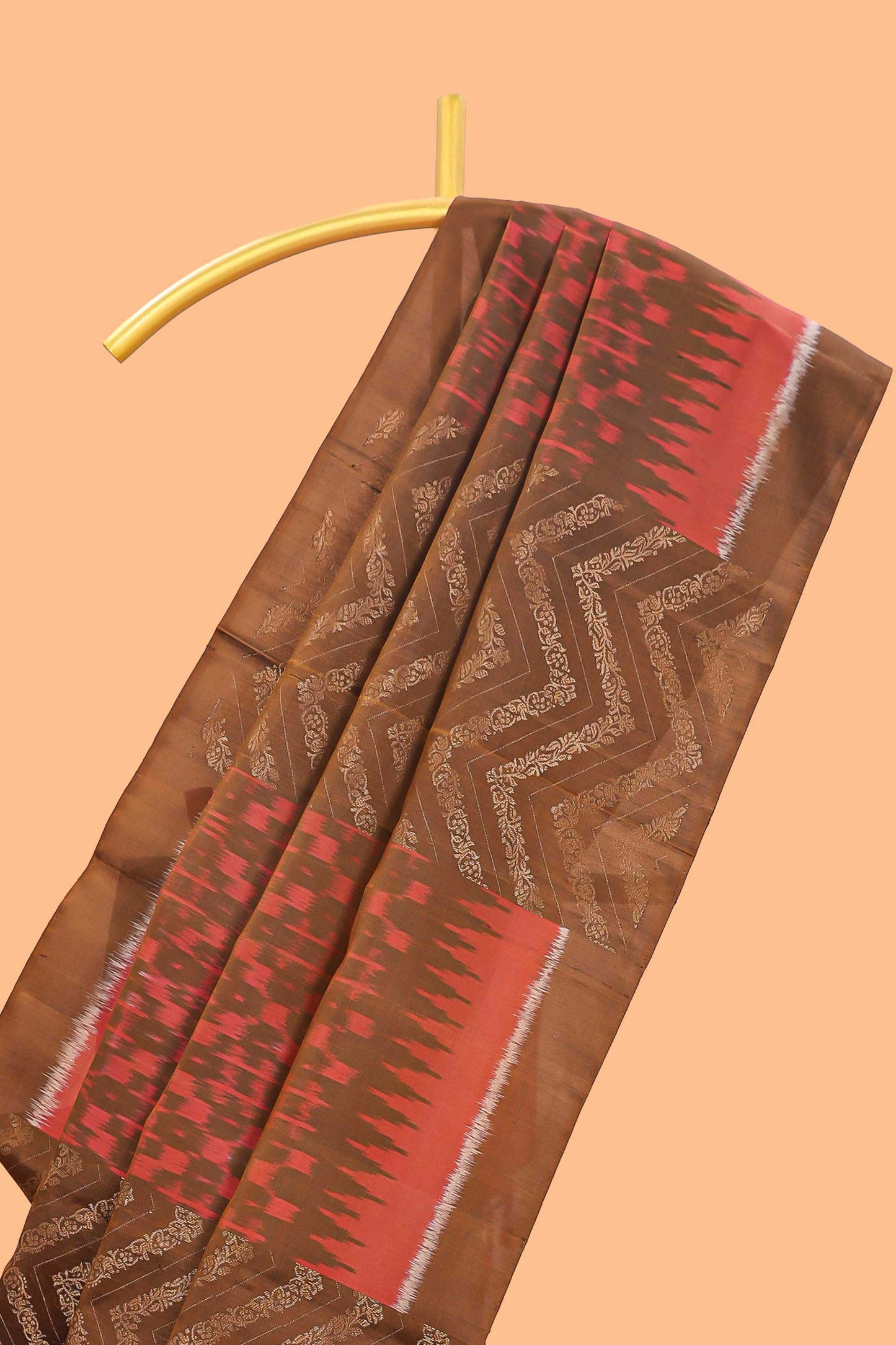 Borderless brown chevron and ikkat style parambariya pattu saree with contrast blouse and pallu