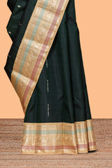Bottle green geometric motifs design parambariya pattu saree with contrast border and blouse