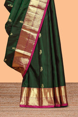Green floral zari motifs design parambariya pattu saree with contrast border and blouse