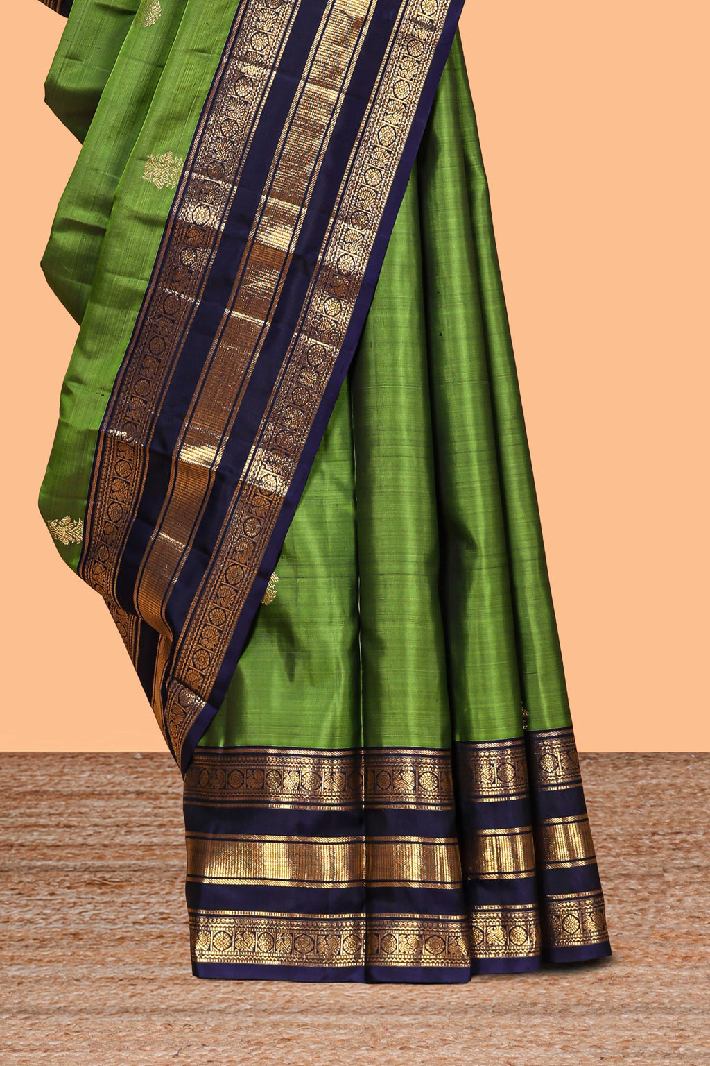 Green zari motifs parambariya pattu saree with contrast zari border and blouse
