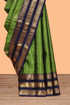 Green zari motifs parambariya pattu saree with contrast zari border and blouse