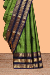 Green zari motifs parambariya pattu saree with contrast zari border and blouse