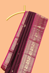 Maroon zari motifs parambariya pattu saree with contrast zari border and blouse