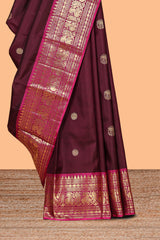 Maroon zari motifs parambariya pattu saree with contrast zari border and blouse