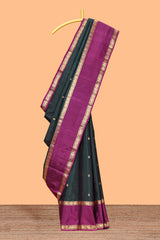 Dark green striped zari motifs parambariya pattu saree with contrast zari border and blouse