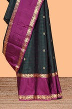 Dark green striped zari motifs parambariya pattu saree with contrast zari border and blouse