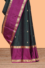 Dark green striped zari motifs parambariya pattu saree with contrast zari border and blouse