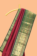 Maroon zari motifs parambariya pattu saree with contrast zari border and blouse