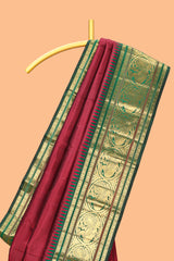 Maroon zari motifs parambariya pattu saree with contrast zari border and blouse