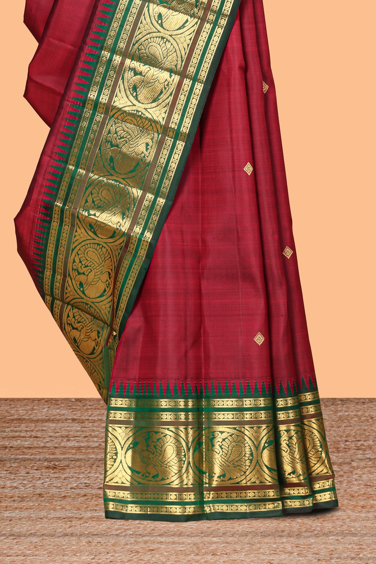 Maroon zari motifs parambariya pattu saree with contrast zari border and blouse