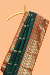 Bottle green floral design zari motifs parambariya pattu saree with contrast zari border and contrast blouse