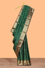 Green checked floral design zari motifs parambariya pattu saree with contrast zari border and contrast blouse