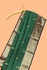 Green checked floral design zari motifs parambariya pattu saree with contrast zari border and contrast blouse