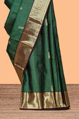 Green checked floral design zari motifs parambariya pattu saree with contrast zari border and contrast blouse