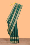Dark green gold zari butta motifs parambariya pattu saree with self zari border and matching blouse