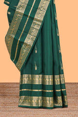 Dark green gold zari butta motifs parambariya pattu saree with self zari border and matching blouse