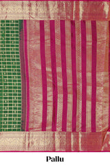 Green Checked butta designed parambariya pattu saree with contrast elephant motif zari border and geometric zari pallu