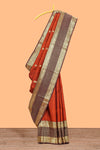 Rust orange butta designed parambariya pattu saree with contrast retta patta zari border and geometric zari designed pallu