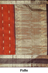 Rust orange butta designed parambariya pattu saree with contrast retta patta zari border and geometric zari designed pallu