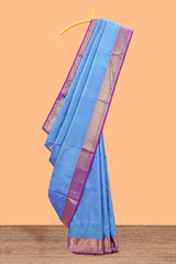 Blue color butta designed parambariya pattu saree with contrast zari border and rich peacock zari motifs pallu