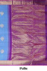 Blue color butta designed parambariya pattu saree with contrast zari border and rich peacock zari motifs pallu