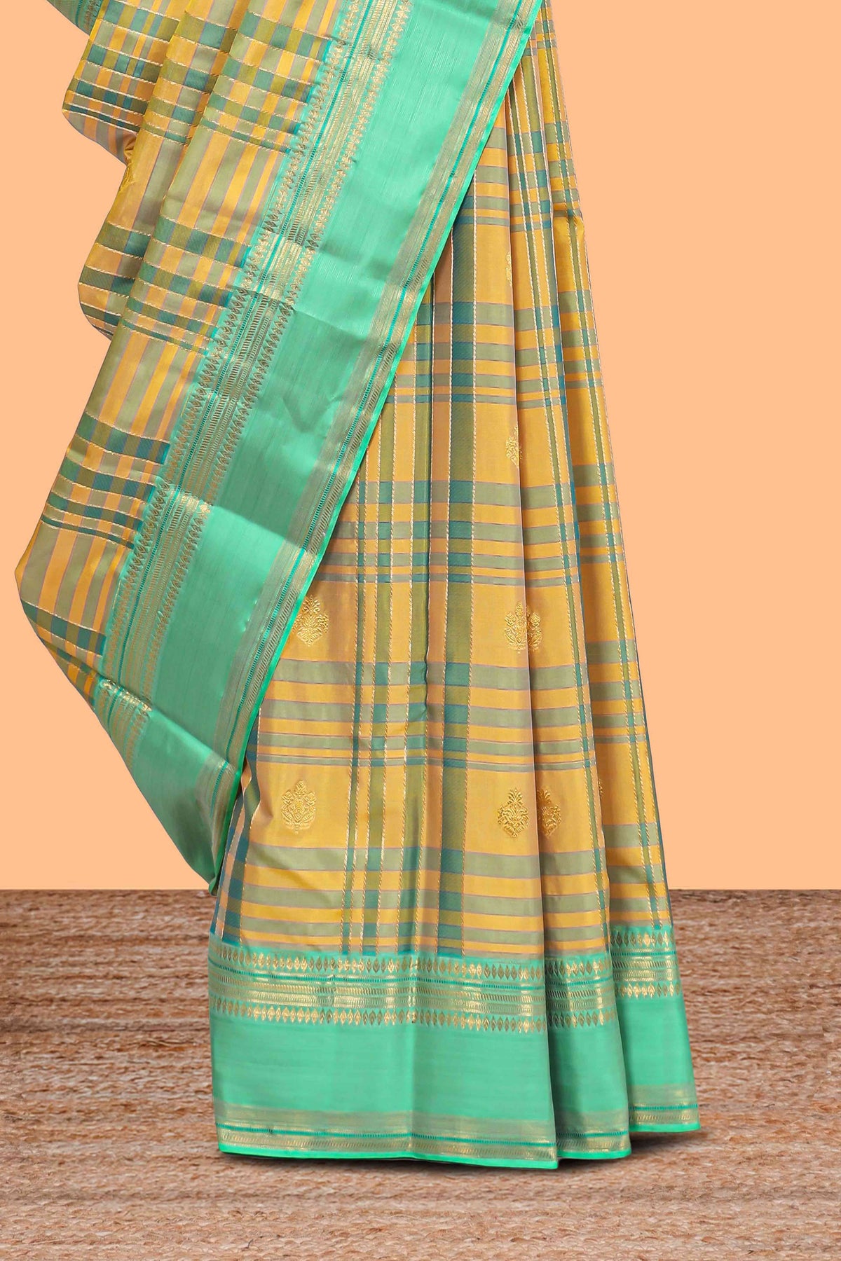 Mustard yellow checked parambariya pattu saree with zari buttas with contrast turquoise green border with zari pallu and plain blouse