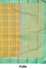 Mustard yellow checked parambariya pattu saree with zari buttas with contrast turquoise green border with zari pallu and plain blouse