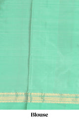 Mustard yellow checked parambariya pattu saree with zari buttas with contrast turquoise green border with zari pallu and plain blouse