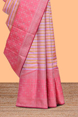 Soft pastel pink zari striped parambariya pattu saree with checked zari border with buttas and pallu comes with plain blush pink blouse