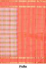 Peach pink with tonal shades checked parambariya pattu saree with contrast border and zari pallu comes with plain blouse