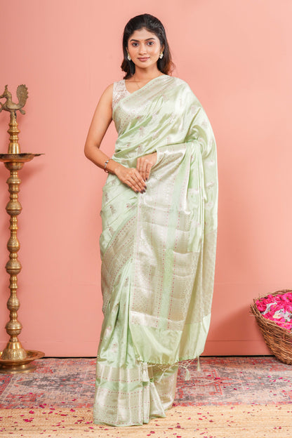 Pastel green raw silk silver zari saree