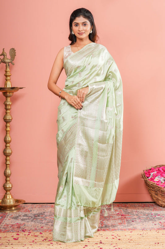 Pastel green raw silk silver zari saree