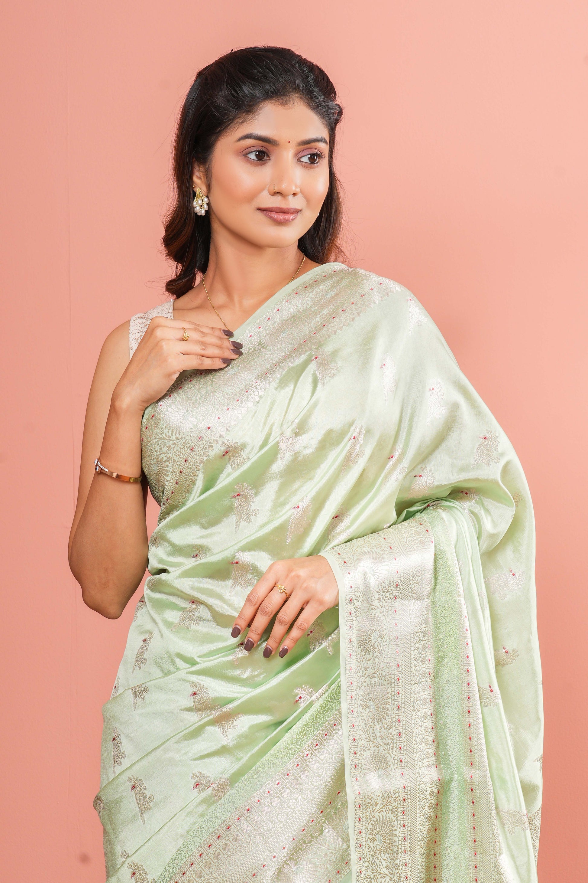 Pastel green raw silk woven saree