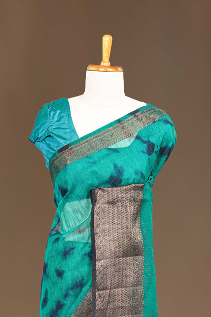 Peacock green linen saree with golden zari
