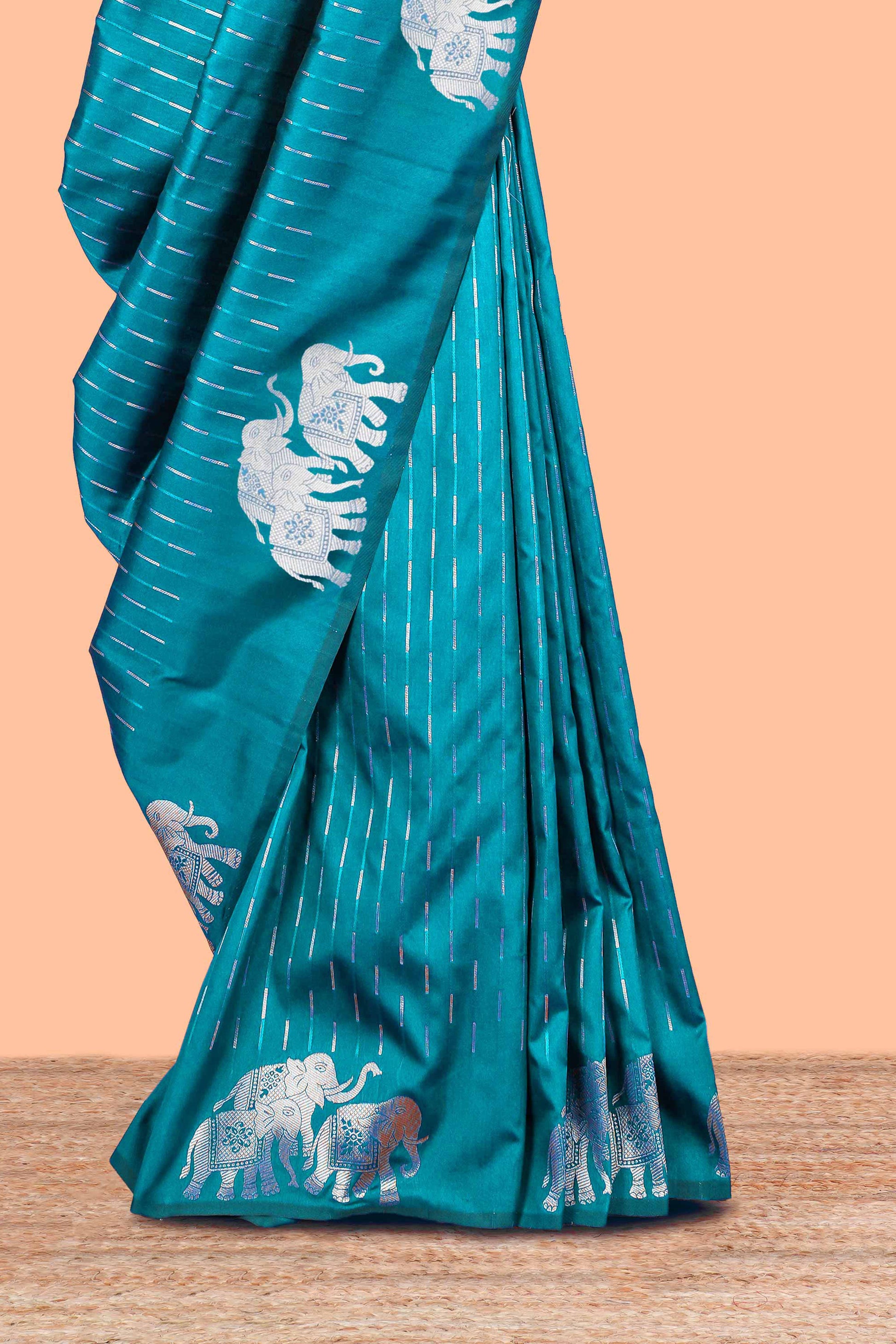 Peacock green semi soft silk woven saree