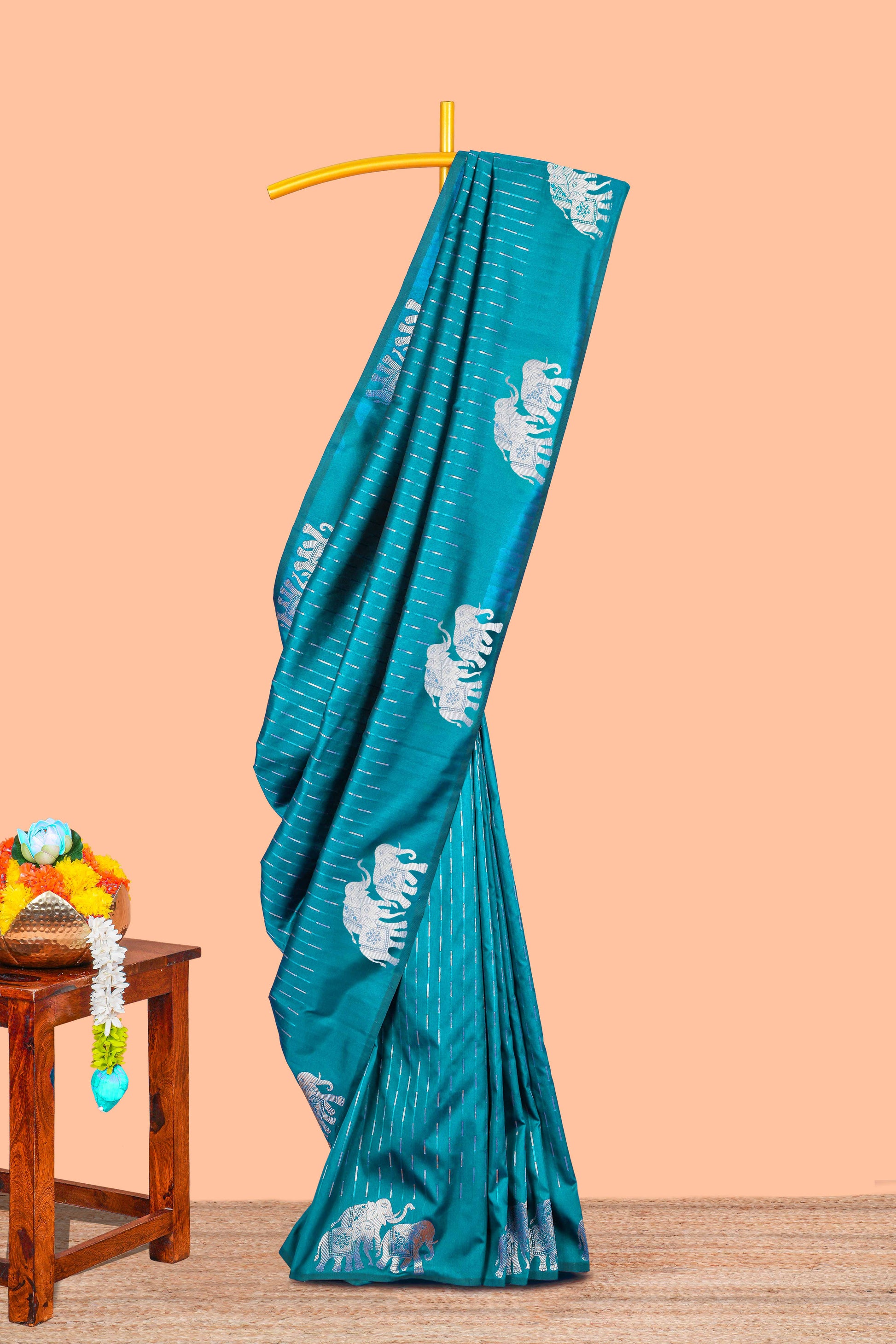 Peacock green semi soft silk zari butta saree