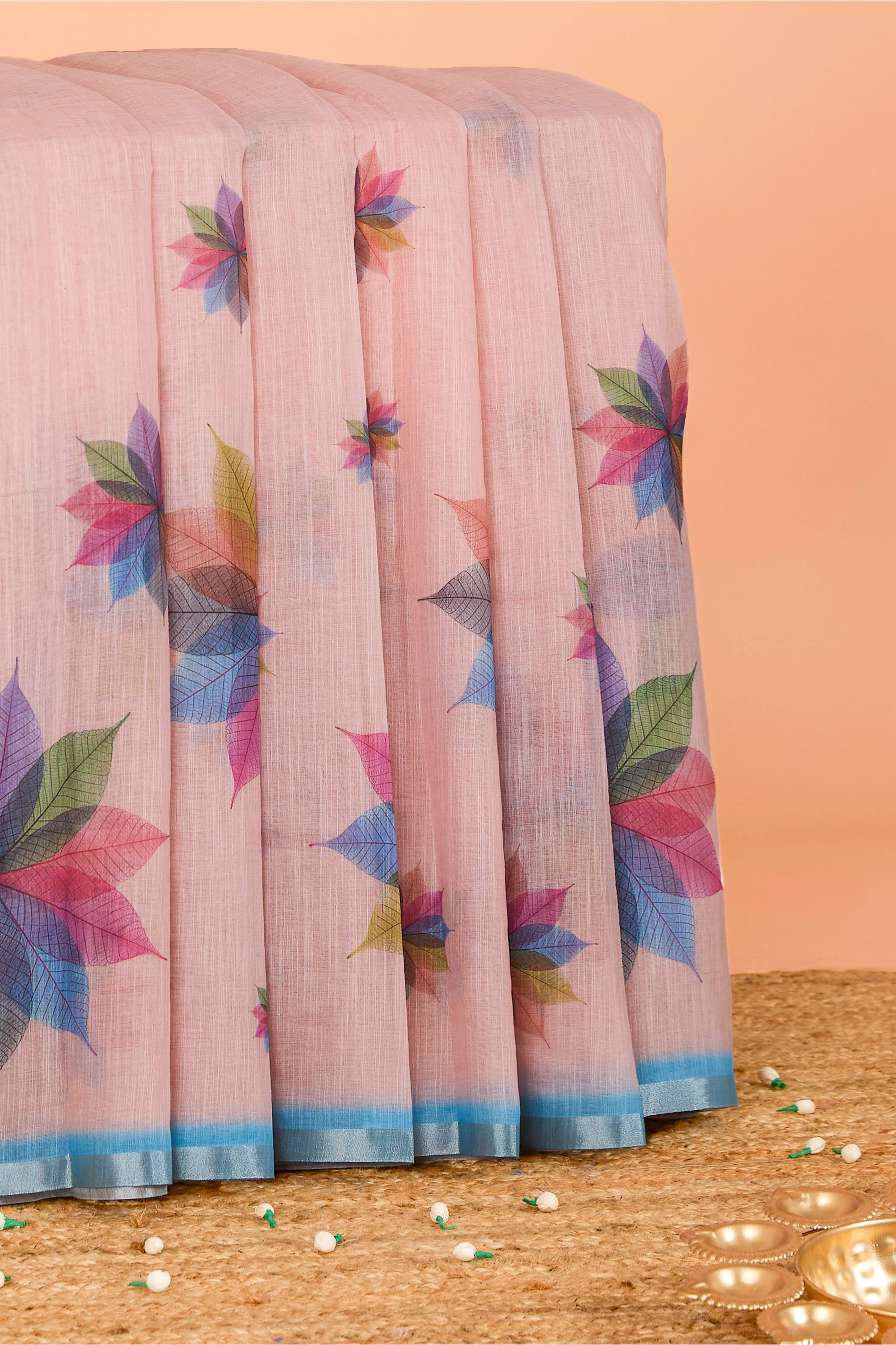 Pink linen saree with floral design