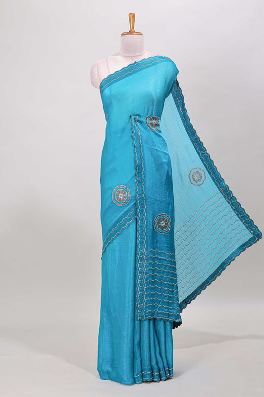 Blue floral stone work motifs semi chiffon saree with self scallop border and matching blouse
