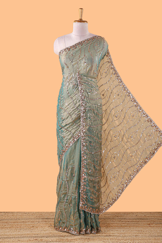 Green wave pattern chamki work all over body designer saree with scallop design border matching blouse