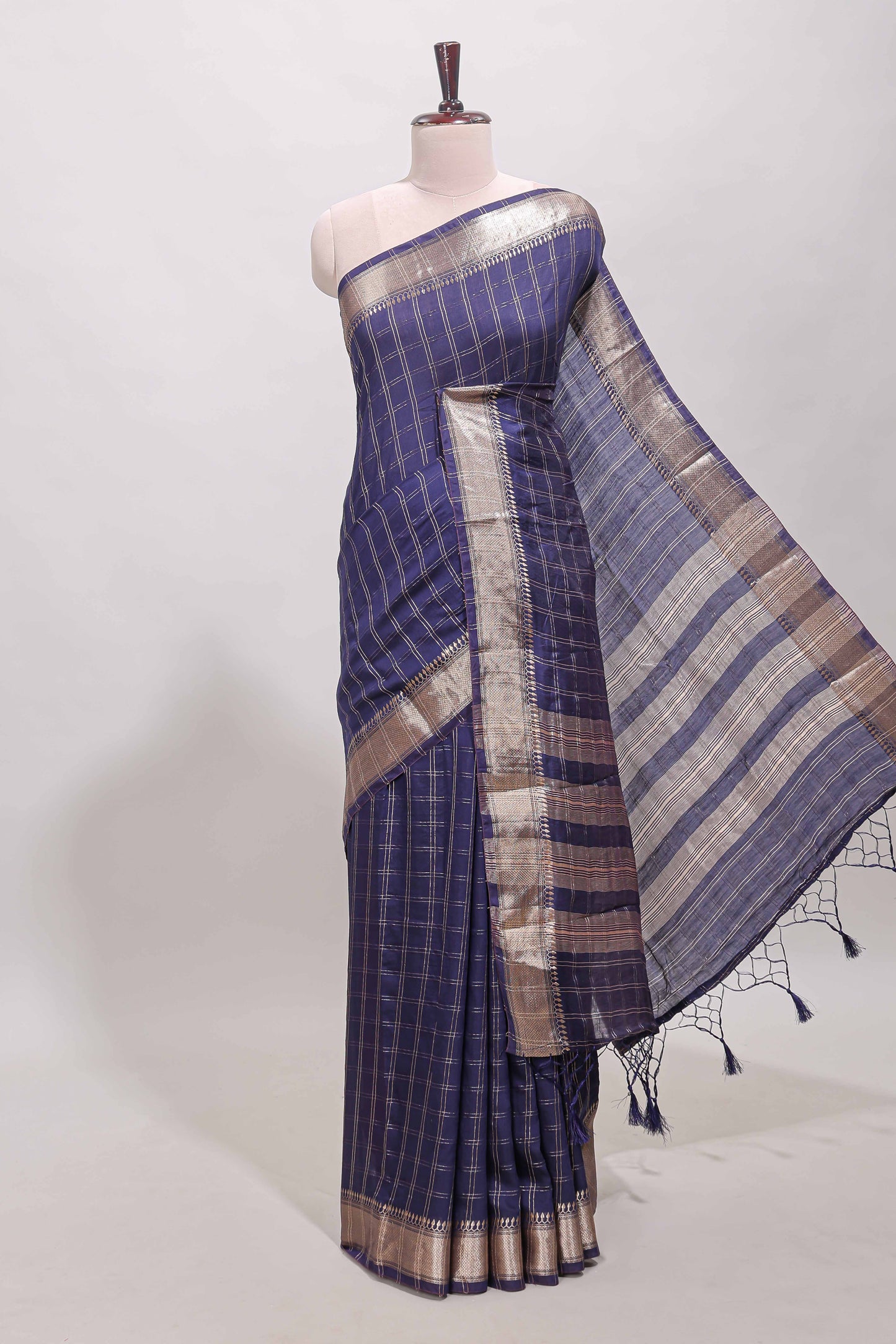 Navy blue checked semi banaras chiffon saree with self zari border and contrast blouse