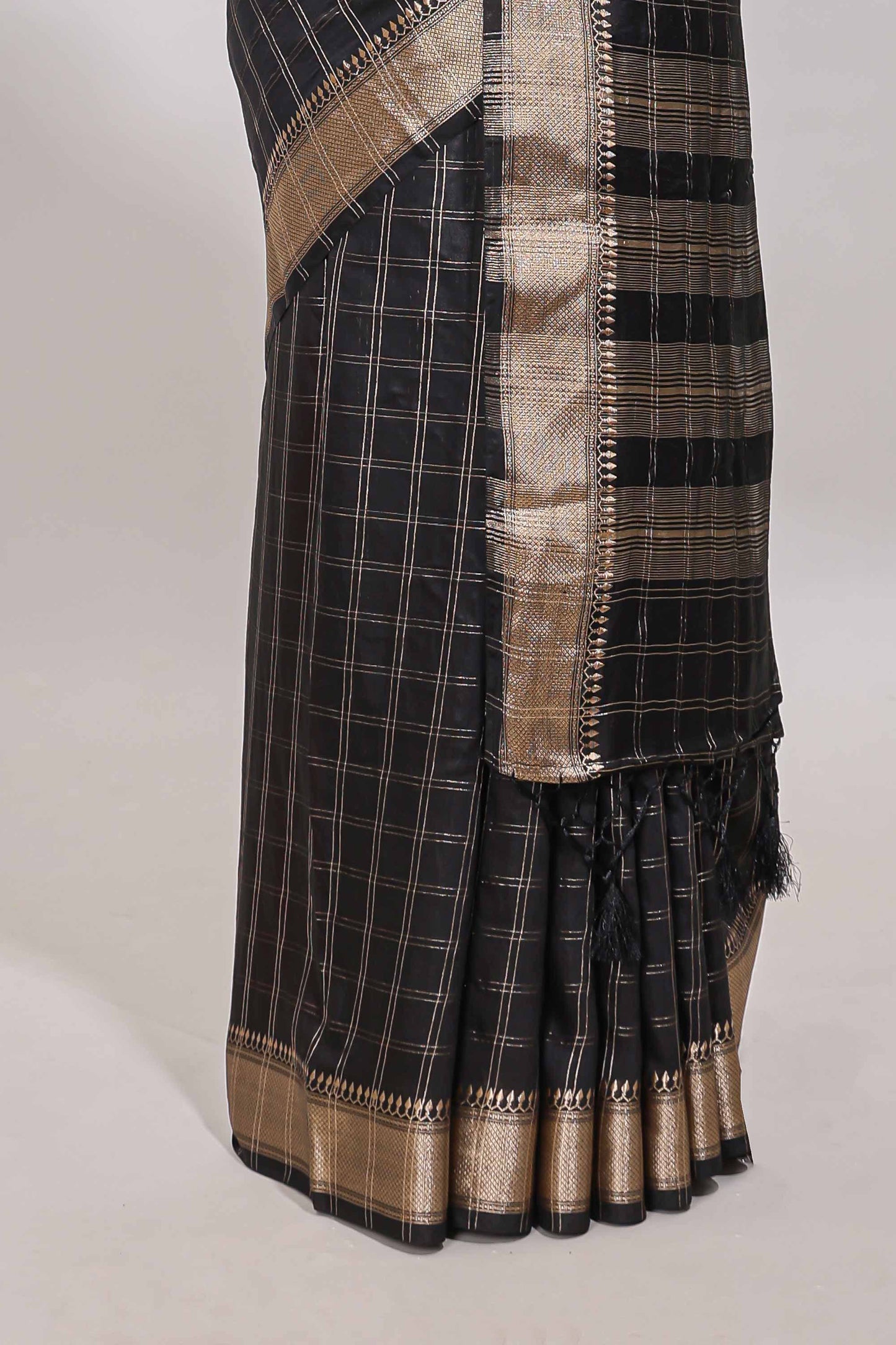 Black checked semi banaras chiffon saree with self zari border and contrast blouse
