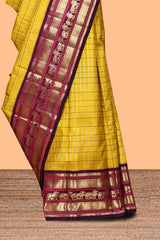 Yellow checked zari design swayamvara pattu saree with contrast zari border and blouse