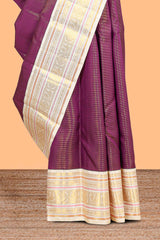 Deep wine striped swayamvara pattu saree withcontrast zari border and blouse