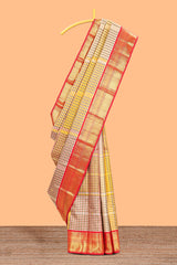 Cream with warm-toned checked swayamvara pattu saree with contrast zari border and pallu along with plain blouse