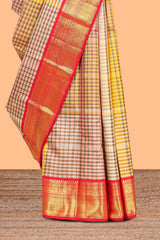 Cream with warm-toned checked swayamvara pattu saree with contrast zari border and pallu along with plain blouse