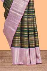 Dark green zari striped swayamvara pattu saree with contrast lavender zari border and pallu comes with plain blouse