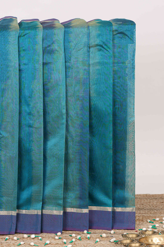 Peacock green plain ikkat cotton saree with contrast border and zari striped pallu