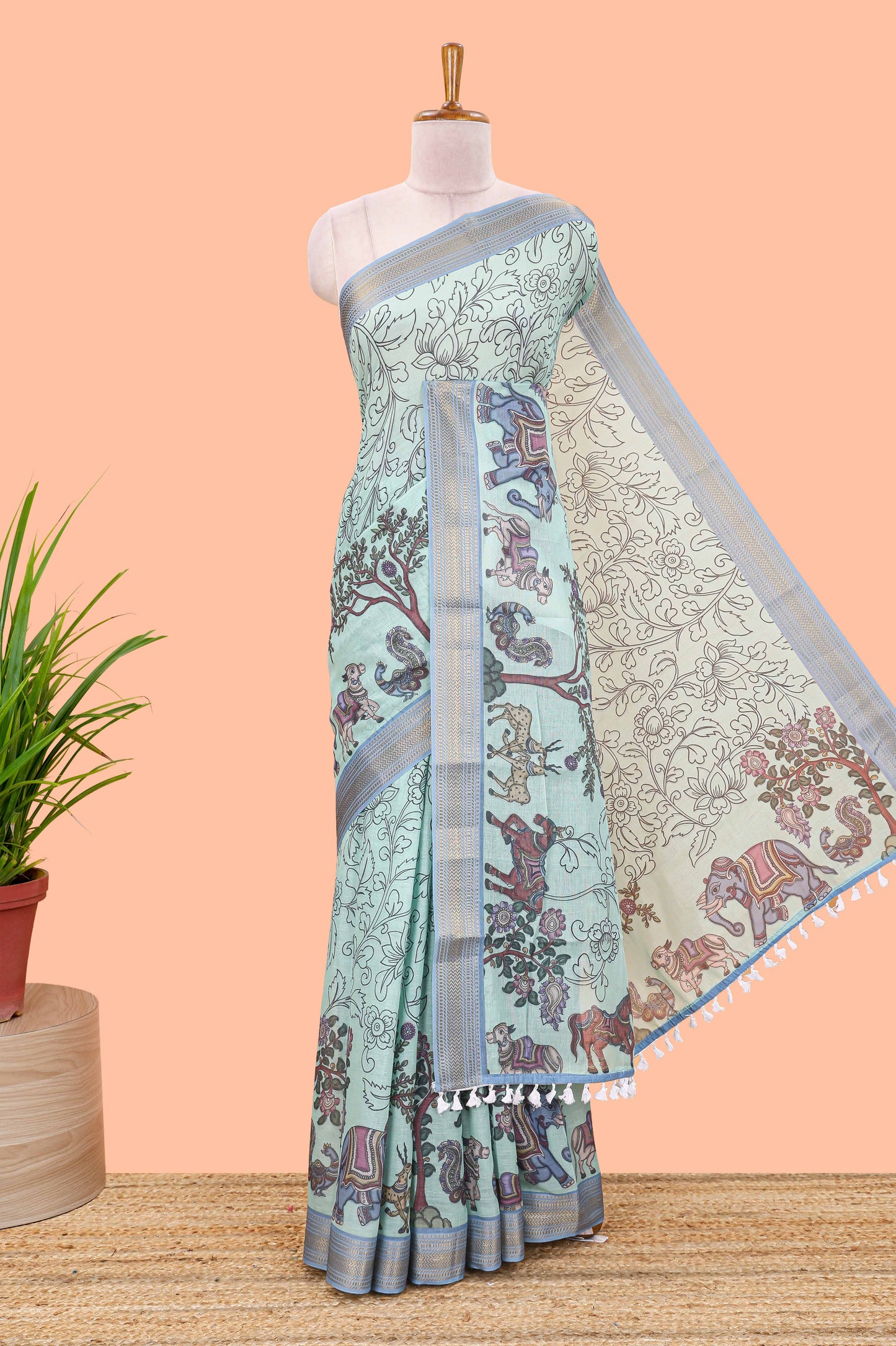 Turquoise green chirala cotton floral and animal theme digital print saree with zari border