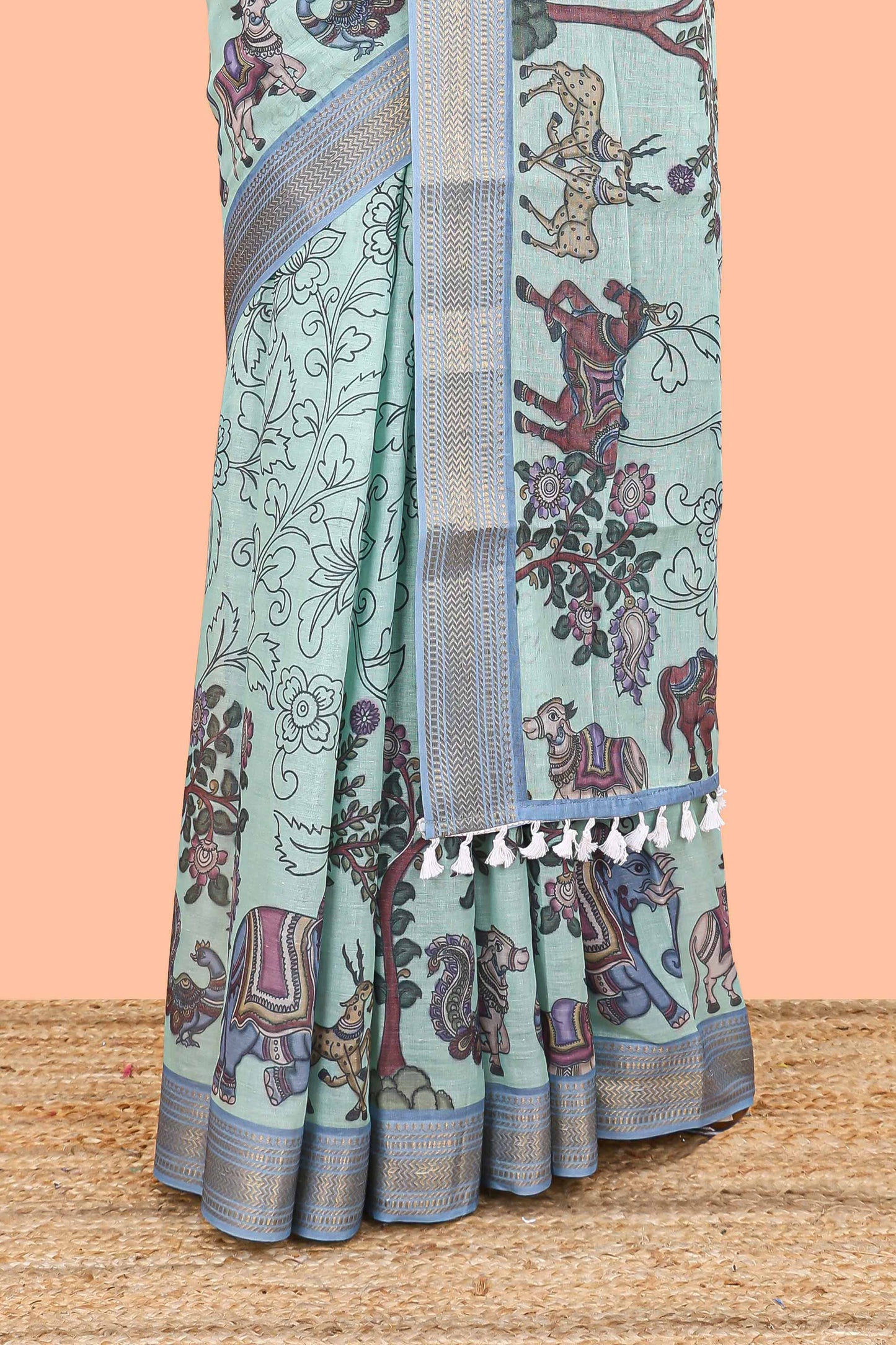 Turquoise green chirala cotton floral and animal theme digital print saree with zari border